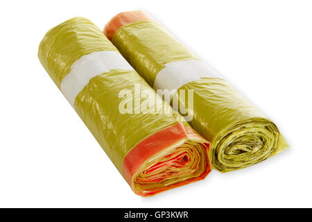 Rolls of yellow trash bags on white background Stock Photo