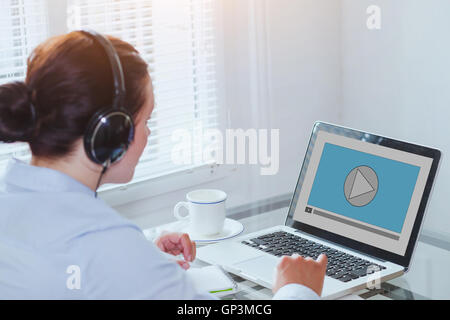 woman watching video tutorial on computer, business education online, multimedia Stock Photo
