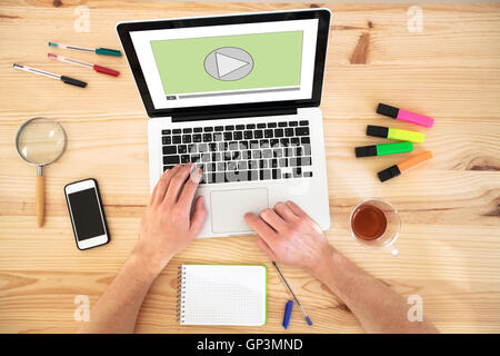 video play button on the screen of laptop computer, audio streaming online, multimedia website Stock Photo