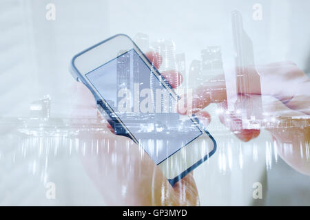 double exposure of hands with smart phone, modern technology of mobile application Stock Photo