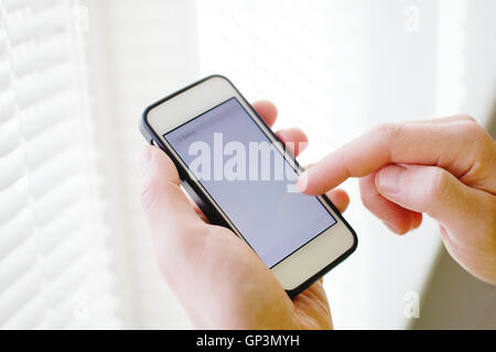 closeup of hands with smart phone, mobile application, empty screen Stock Photo