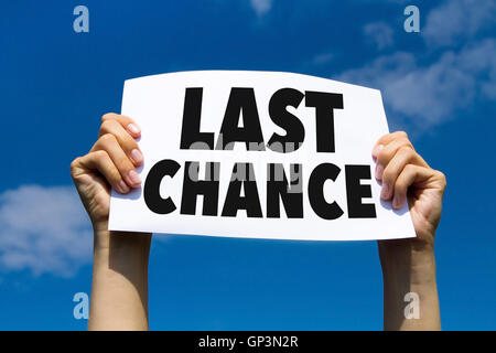 last chance, concept, hands holding paper sign Stock Photo