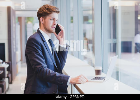 businessman on the phone, business travel, airport Stock Photo