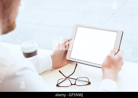 businessman holding tablet with empty blank white screen, checking email Stock Photo