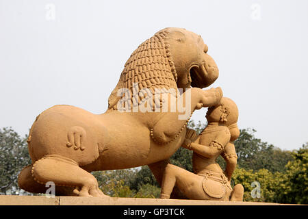 Stone statue of lady playing with lion at Kandariya Mahadev Temple, under Western Group of Temples, Khajuraho, Madhya Pradesh, I Stock Photo