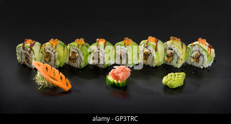 Fresh Uramaki maki sushi rolls with avocado and caviar Stock Photo