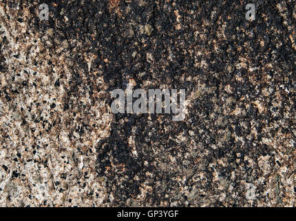Close-up of an old granite stone pattern with black colorization. Stock Photo