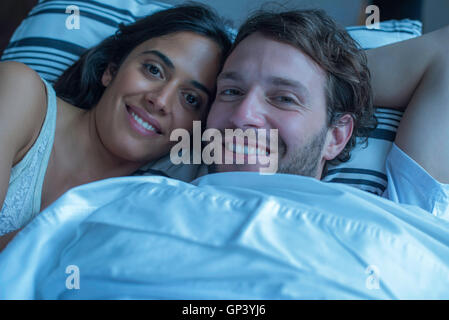 Couple in bed together, portrait Stock Photo