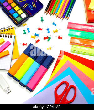 School supplies background, colorful paper, markers, pencils and other different stuff on the desk Stock Photo