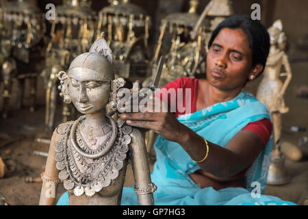 Woman crafting handicrafts out of wrought iron, bastar, chhattisgarh, india, asia Stock Photo