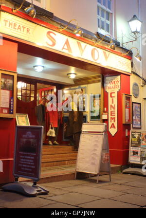 Theatre goers exit the Savoy Theatre and cinema in the town centre of Monmouth, Monmouthshire, Wales. Stock Photo