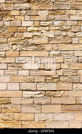Eroded sandstone block wall Stock Photo