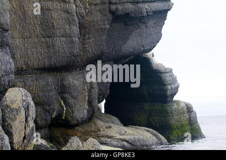 Monumental rocky cliffs on coast of South island of the Novaya Zemlya archipelago. Rock arch Stock Photo