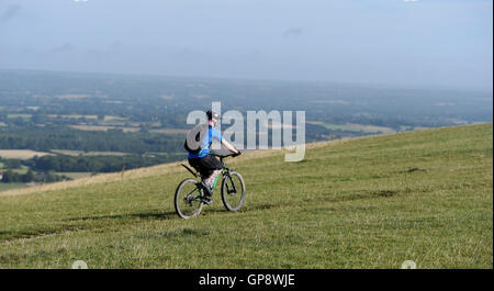 Devils Dyke Brighton UK 3rd September 2016 - A cyclist enjoys a beautiful warm sunny morning on the South Downs at Devils Dyke near Brighton but the weather is forecast to become wet throughout Britain later in the day  Credit:  Simon Dack/Alamy Live News Stock Photo