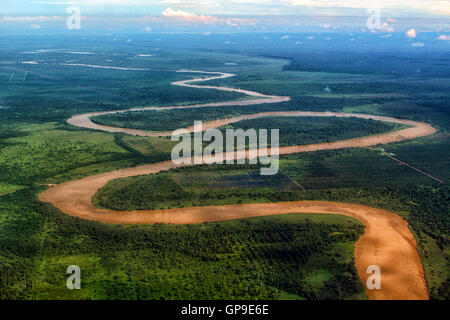 GUNUNG MULU/MALAYSIA - CIRCA NOVEMBER 2015: Aerial view of the Sungai Tutoh river and its brown muddy waters near Gunung Mulu Stock Photo