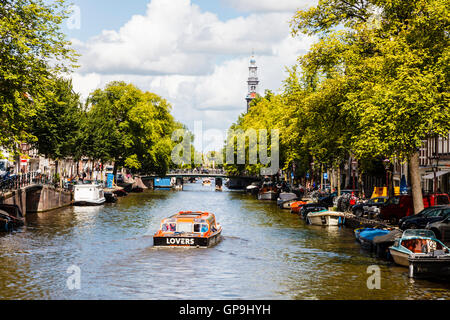 A view along the Prinsengracht canal towards the Westerkerk, Amsterdam Holland Netherlands Stock Photo