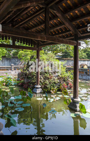 Lotus pool and Truong Du Pavilion, Dien Tho Palace, Imperial City, Hue, Viet Nam Stock Photo