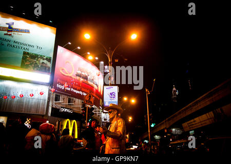 Gold statue street performer in Kuala Lumpur, Malaysia Stock Photo