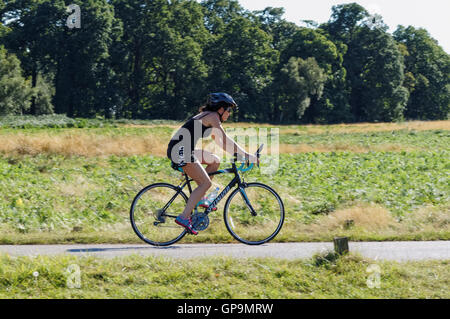Cyclists in Richmond Park on Sawyer's Hill, London England United Kingdom UK