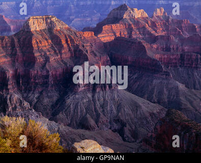 USA, Arizona, Grand Canyon National Park, North Rim, Sunset light on (from left to right) Deva, Brahma and Zoroaster Temples. Stock Photo