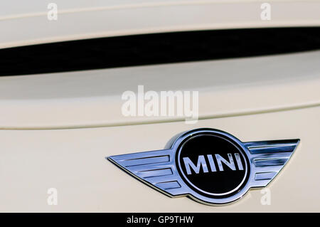 Mini logo badge on the bonnet of a pepper white car Stock Photo