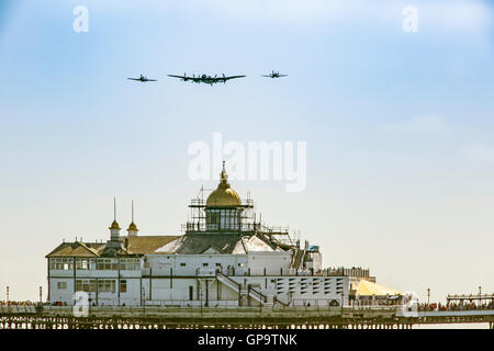 Eastbourne Airbourne  Battle of Britain Memorial flight BBMF Lancaster Spitfire and Hurricane fly Over Eastbourne Pier Stock Photo