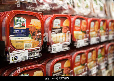 Hillshire Farms brand packaged lunch meats in the refrigerator case at a grocery store. Stock Photo