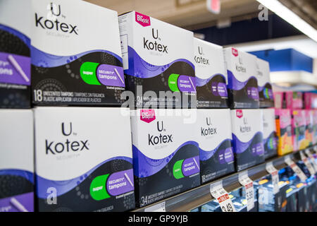 Stacks of Kotex brand tampons on a shelf at a pharmacy Stock Photo