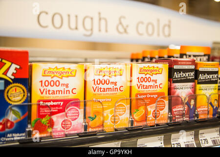 Boxes of Emergen-C and Airborne products on the shelf of a pharmacy Stock Photo