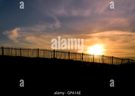 A spectacular sunset breaks over Porth Island in Newquay, Cornwall. Stock Photo