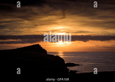 A stunning sunset over Porth Island in Newquay, Cornwall. Stock Photo