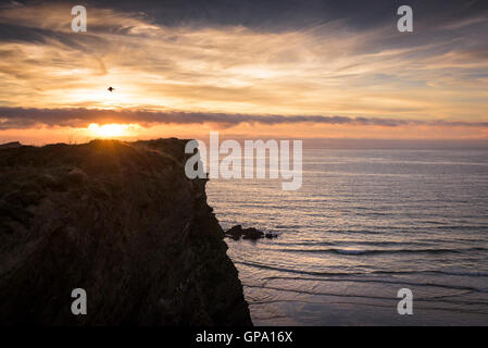 A spectacular sunset over Trevelgue Head in Newquay, Cornwall Stock Photo