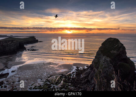 A spectacular sunset breaks over Whipsiderry Beach in Newquay, Cornwall. Stock Photo
