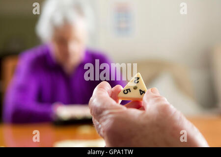 Elderly people keeping mentally active Stock Photo