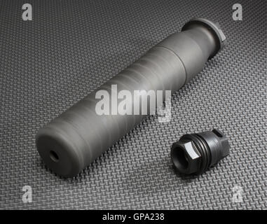 Suppressor and its barrel mount on a grey background Stock Photo - Alamy