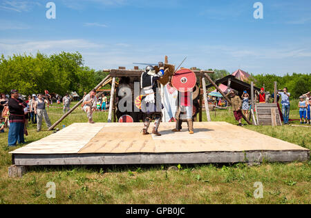 Historical restoration of knightly fights on free festival of medieval culture Stock Photo