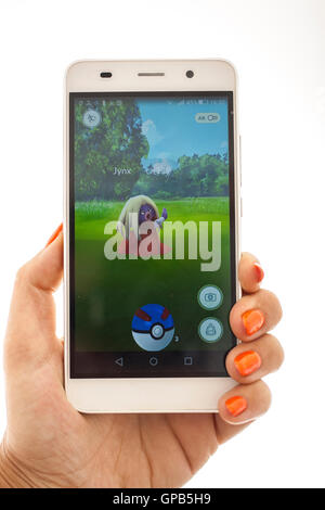 Jynx pokemon attack in white smartphone try catch with blue pokeball great ball studio photo photography Stock Photo