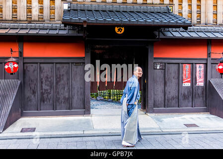 Kyoto, Japan - April 23, 2014: Old man in front of Ichiriki Chaya entrance in Gion district. Stock Photo