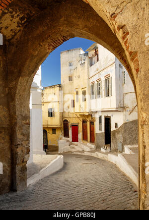 View to a narrow street through the city gate in Tangier, Morocco Stock Photo