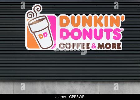 Dunkin' Donuts sign on a wall Stock Photo