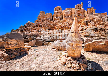 Antique statues on the top of Nemrut mountain at sunrise, Turkey Stock Photo