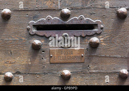 detail of an antique wooden door in Tuscany, Italy Stock Photo