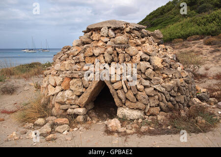 Lamb's shelter, on Binigaus bay, in Minorca, near San Tomas. Used as an animal shelter centuries ago. Walkable from San Tomas. Stock Photo