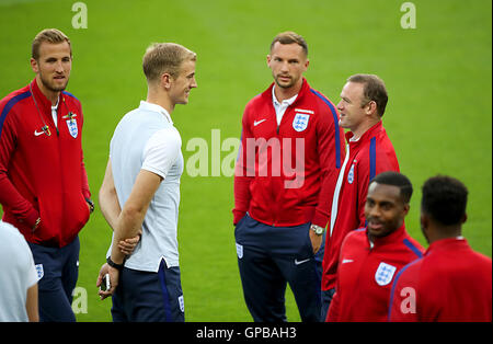England goalkeeper Joe Hart (left) speaks with Captain Wayne Rooney during a walkaround at the City Arena, Trnava. PRESS ASSOCIATION Photo. Picture date: Saturday September 3, 2016. See PA story SOCCER England. Photo credit should read: Nick Potts/PA Wire. RESTRICTIONS: Use subject to FA restrictions. Editorial use only. Commercial use only with prior written consent of the FA. No editing except cropping. Call +44 (0)1158 447447 or see www.paphotos.com/info/ for full restrictions and further information. Stock Photo