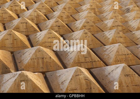 Historic building facade in Rome decorated with repeating triangular geometric patterns Stock Photo