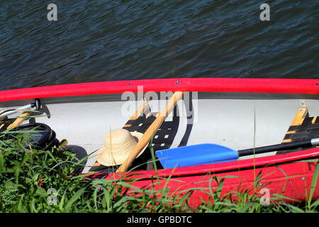 Abandoned fishing paddle boat on sand of sea bay. Quiet sea water level  within morning windless Stock Photo - Alamy