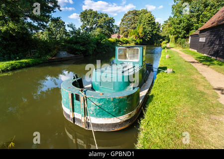 Unusual working boat owned by National Trust, possibly a dredger, moored at Worsfold Gates, Wey Navigation near Send, Surrey Stock Photo