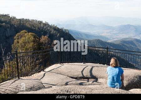 Woman admiring view at Mt Buffalo Lookout Stock Photo