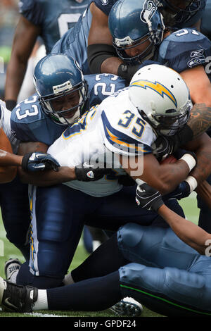 Seattle Seahawks defenders Bobby Wagner, (54), Marcus Trufant, (23)  cerebrate with Richard Sherman after he intercepted a New England Patriots  pass at CenturyLink Field in Seattle, Washington on October 14, 2012. With