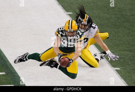 Pittsburgh Steelers Strong Safety Troy Polamalu (43) tackles Miami Dolphins  Tight End Randy McMichael (81) during a second quarter downpour on  September 26, 2004 at Pro Player Stadium in Miami, Fl. The